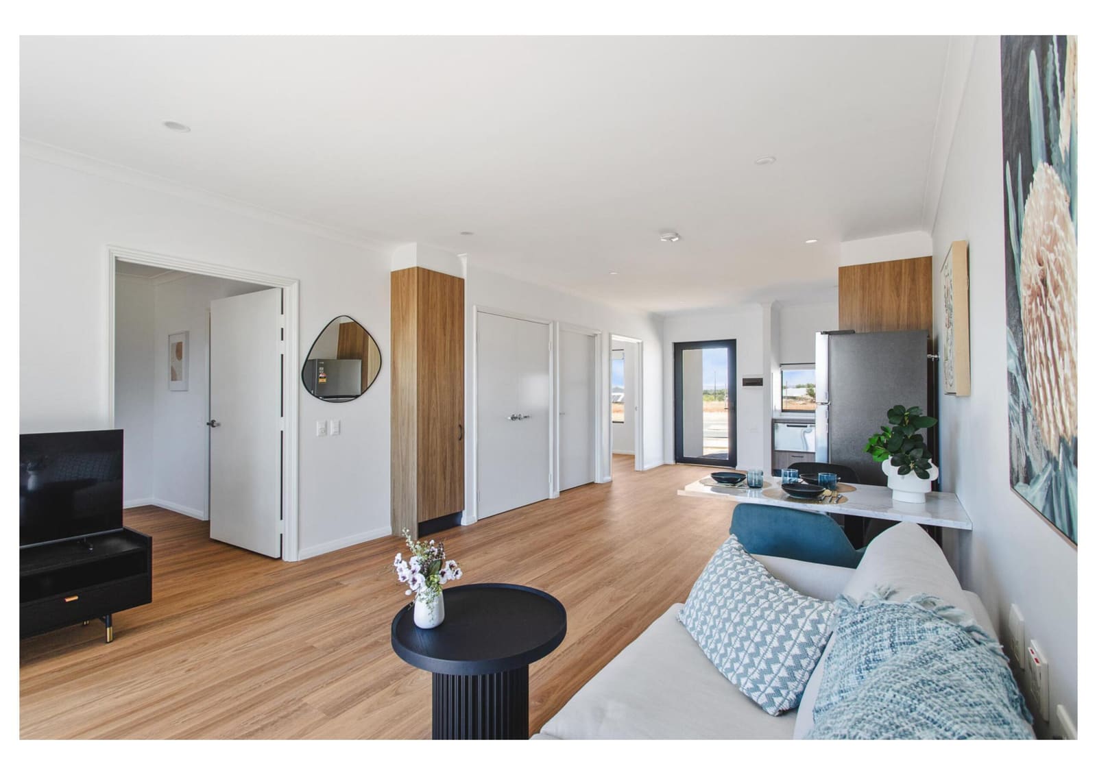 Open-plan living and dining area inside one of our homes