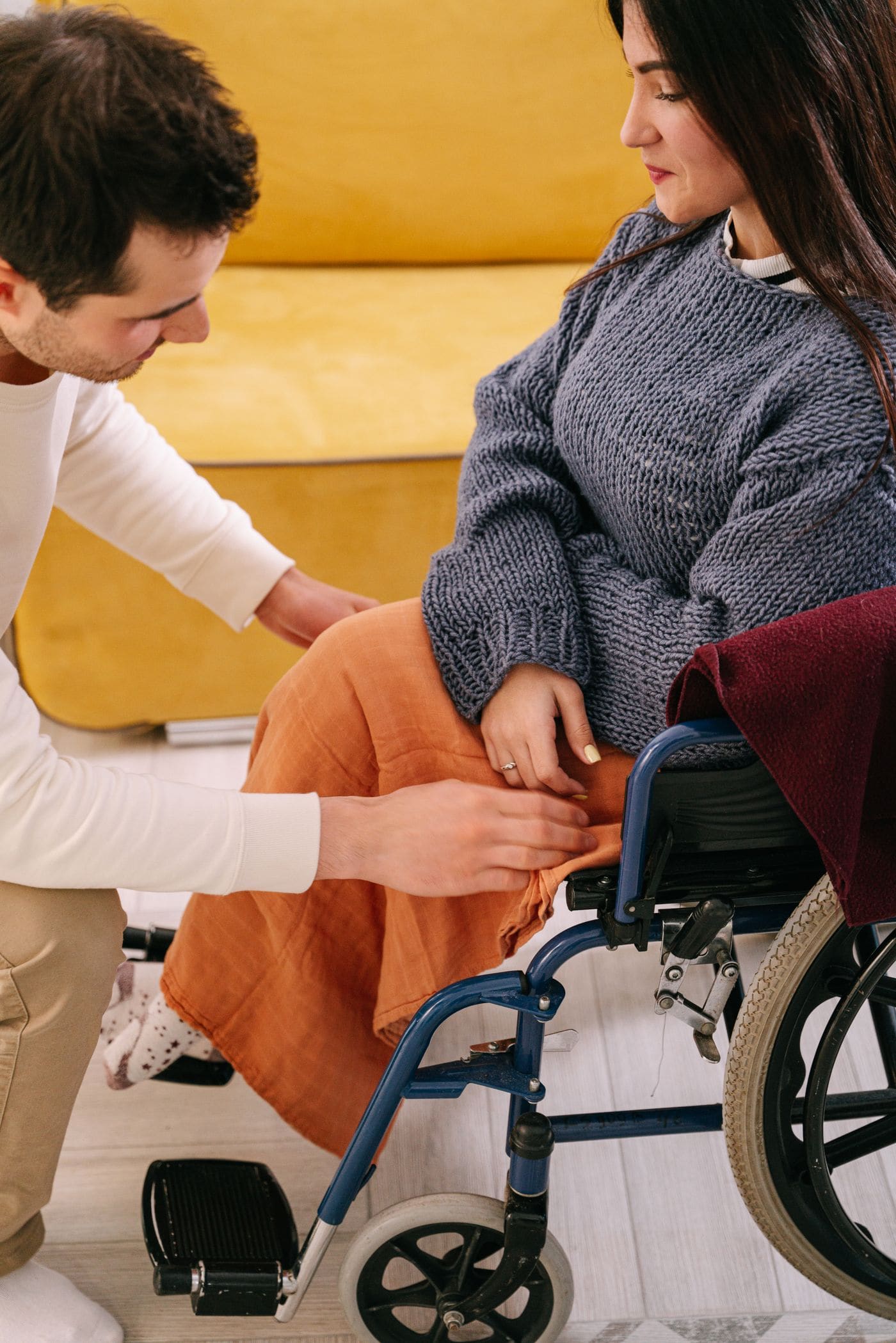 A carer supporting an older man at home